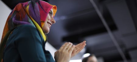 Arab business women clapping
