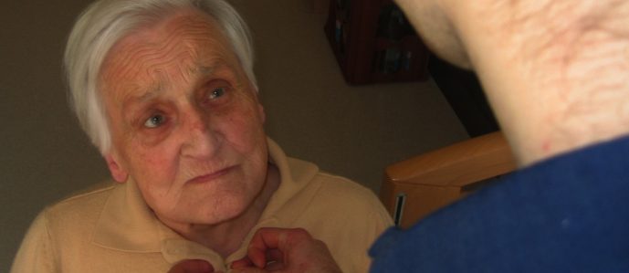 elderly person being helped