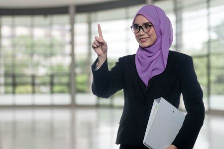 Arab woman with finger in air