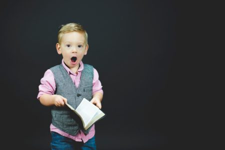A boy holding a book